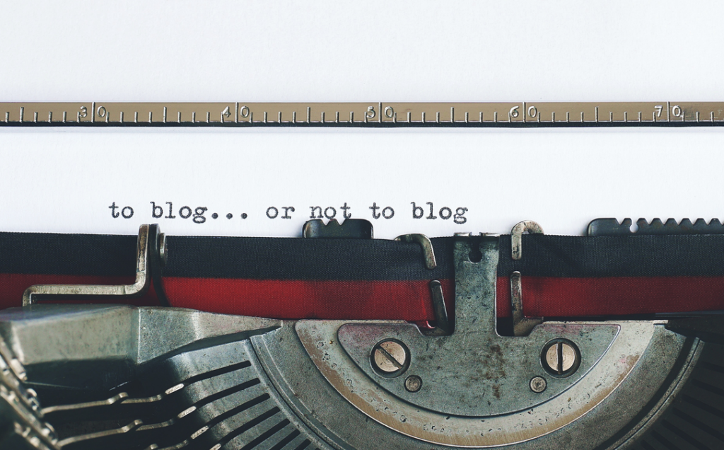 Typewriter showing the words: blog... or not to blog.